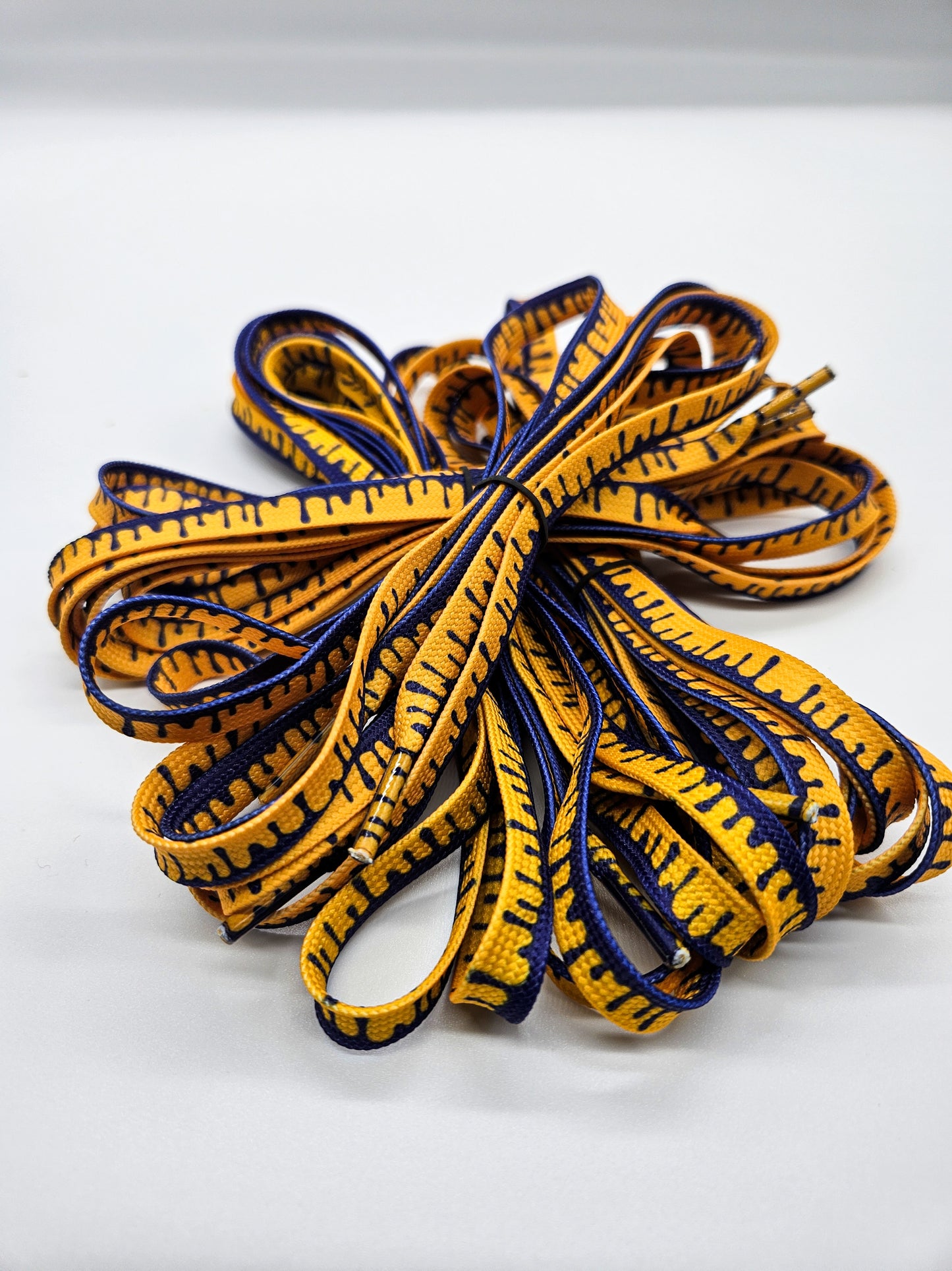 Purple & yellow drip shoelaces