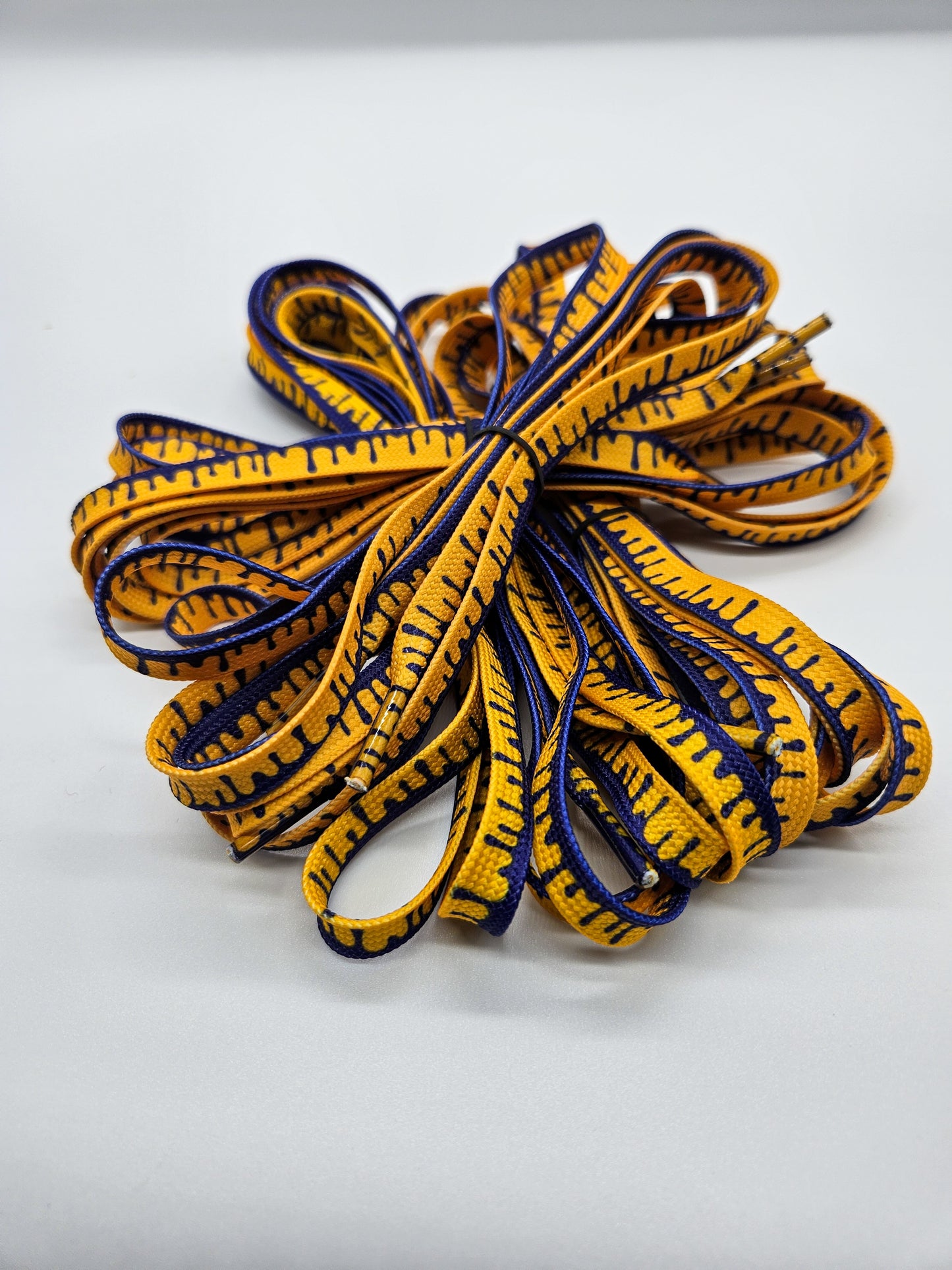 Purple & yellow drip shoelaces